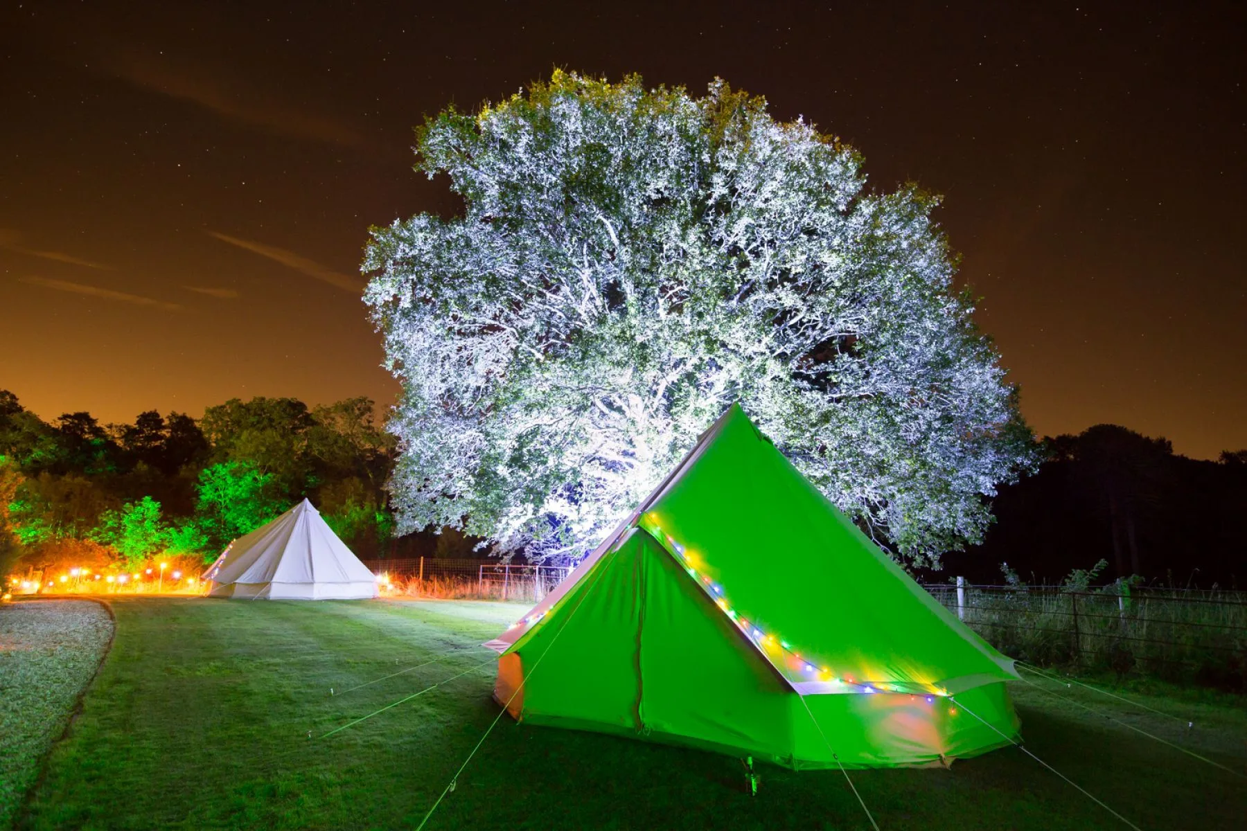 Glamping Tents Lit Up – Outdoor Event Spaces